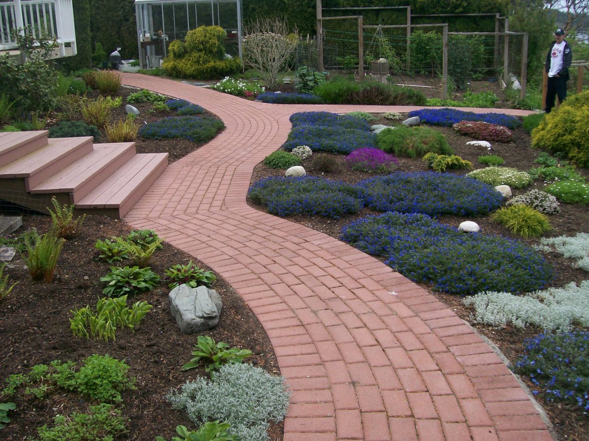 brick sidewalk with gardens